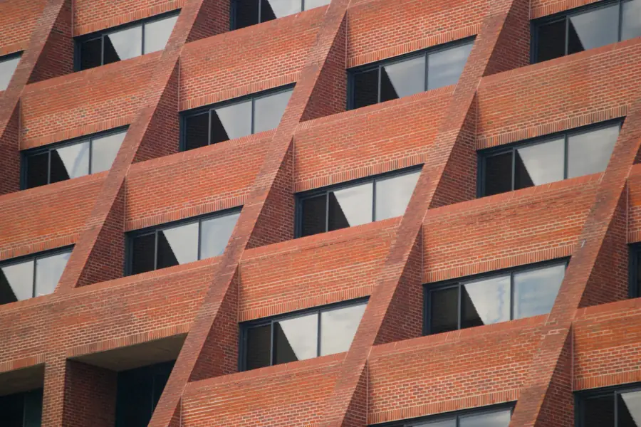A red-brick façade with angled window frames