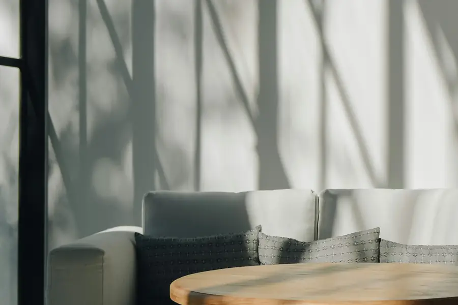 Window-screen shadows on a white wall