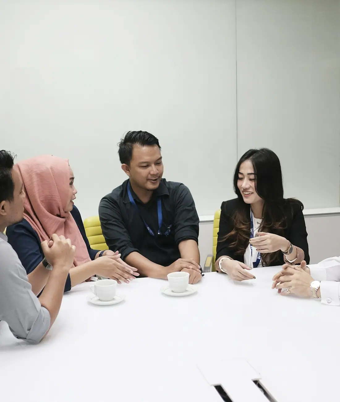 Haluan advisors and a client team around a meeting table