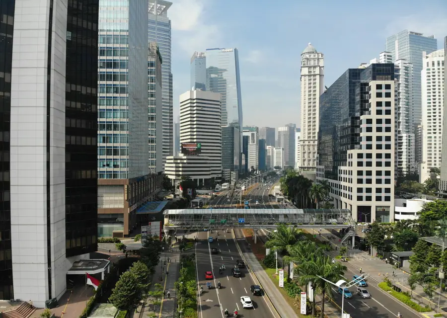 A wide avenue between office towers in Jakarta