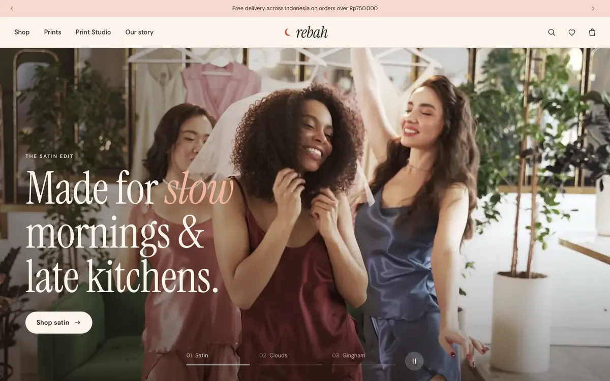 Rebah sleepwear store homepage with friends dancing in satin pyjamas