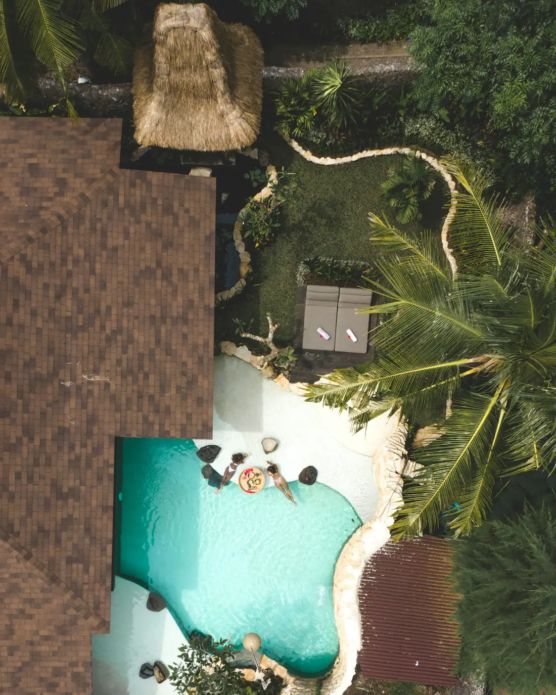 A floating breakfast tray in a jungle pool, seen from above