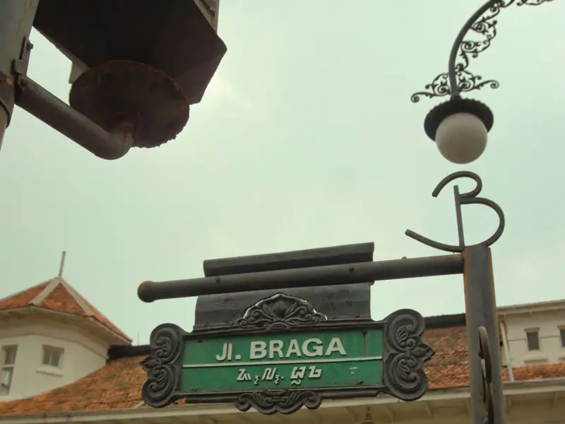 The Jl. Braga street sign on an old lamp post
